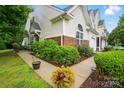 Charming home with lush landscaping, manicured bushes, and a well-maintained walkway at 3071 Des Prez Ave, Fort Mill, SC 29707