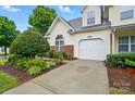 Home's exterior featuring well-maintained landscaping and an attached one car garage at 3071 Des Prez Ave, Fort Mill, SC 29707