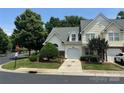 Charming home featuring a well-manicured lawn and an attached garage with a concrete driveway at 3071 Des Prez Ave, Fort Mill, SC 29707