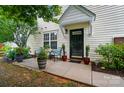 Charming front porch with seating area, potted plants, and a welcoming entryway at 3071 Des Prez Ave, Fort Mill, SC 29707