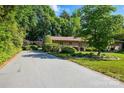 Beautiful brick home featuring manicured landscaping and a paved driveway at 308 Odell St, Kannapolis, NC 28083
