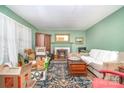 View of living room with a fireplace, and packed boxes at 3526 Craig Ave, Charlotte, NC 28211