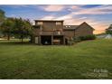 Spacious backyard with a two-story brick home featuring a deck and lower level garage at 3998 Holly Springs Dr # 20, Newton, NC 28658