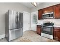 Kitchen with stainless steel refrigerator and appliances, and featuring dark wood cabinetry at 425 1St Se Ave, Hickory, NC 28602