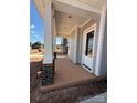 Spacious covered porch with white columns and gray siding at 4419 Splash Trl # 158, Sherrills Ford, NC 28673