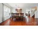 Elegant dining room with seating for six, with wood floors and natural light at 512 Nanny Point Dr, Monroe, NC 28110
