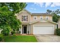 Charming two-story home with a two-car garage and well-maintained lawn at 512 Nanny Point Dr, Monroe, NC 28110