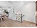 Open-concept home featuring a staircase, lovely decor, and natural light filtering throughout the space at 5508 Swaling St, Charlotte, NC 28217