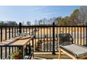 Relaxing balcony area with outdoor furniture and neighborhood views at 5731 Castlerea Dr, Charlotte, NC 28217