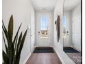 Welcoming entryway with hardwood floors and contemporary decor at 5731 Castlerea Dr, Charlotte, NC 28217