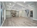 Finished basement with a cozy fireplace, custom built-ins, and ample living space at 7215 Alexander Rd # 4, Charlotte, NC 28270