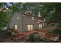 Lovely backyard of a house with a spacious wooden deck, perfect for outdoor entertaining at 8117 Rising Meadow Rd, Charlotte, NC 28277