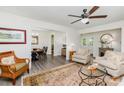 Inviting living room features hardwood floors, ceiling fan, and an adjacent dining area at 1041 Brawley School Rd, Mooresville, NC 28117