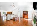 Bright living room features hardwood floors, fireplace, vaulted ceilings and opens to the kitchen at 115 Meadow Lake Dr, Salisbury, NC 28146