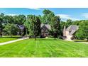 Beautiful home boasts a well-maintained lawn, mature trees, and inviting facade perfect for suburban living at 132 Parkside Ln, Mooresville, NC 28117