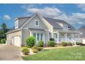 Charming home featuring manicured landscaping and a well-maintained lawn for a beautiful curb appeal at 1327 Springlake Rd, York, SC 29745