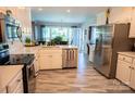 Bright kitchen features stainless appliances, stylish flooring, and ample counter space at 150 Wordsworth Way, Mooresville, NC 28115