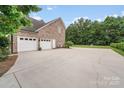 Spacious driveway leading to a three-car garage, perfect for ample parking at 1533 Ohara Plantation Ct, Dallas, NC 28034