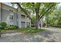 Condominium exterior featuring well-kept lawns, mature trees, and convenient parking at 226 Queens Rd # 68, Charlotte, NC 28204