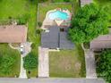 An aerial view showcases a well-maintained home with a large yard, swimming pool, and ample parking space at 2666 Hill Ln, Gastonia, NC 28054