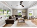 Comfortable living room with a large sofa, natural light, and ceiling fan at 403 W 2Nd St, Cherryville, NC 28021