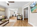 Open-concept living room with hardwood floors flowing to the kitchen at 403 W 2Nd St, Cherryville, NC 28021