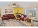 Comfortable living room with warm colors, a fireplace, and ample seating for relaxation and entertainment at 4810 Shea Ct, Monroe, NC 28110