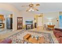Spacious living room with neutral tones, featuring a large television, decorative furniture, and bright lighting at 4810 Shea Ct, Monroe, NC 28110