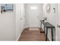 Inviting entryway with hardwood floors, a console table, and a decorative mirror at 5023 Daybell St, Charlotte, NC 28214