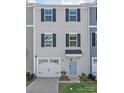 Charming two-story townhome with a one car garage and light blue door at 5023 Daybell St, Charlotte, NC 28214