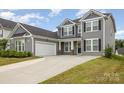 Beautiful two-story home with a spacious driveway and well-maintained lawn at 5043 Baileys Run Dr, Rock Hill, SC 29732