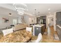 Open concept living space with a stylish dining area and modern kitchen at 5043 Baileys Run Dr, Rock Hill, SC 29732