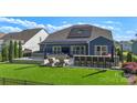 Outdoor oasis with a luxurious patio, outdoor bar, hot tub, and artificial turf for easy maintenance at 5050 Havencrest Dr, Fort Mill, SC 29715