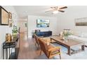 Cozy living room with a large TV, hardwood floors, comfortable seating, and natural light for a relaxing atmosphere at 507 Newsome Rd, Salisbury, NC 28146