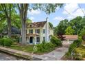 Spacious home with a detached garage, mature trees, and a well-manicured lawn at 522 Alexander St, Statesville, NC 28677