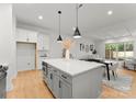 Modern kitchen featuring a spacious island, stainless steel appliances, and an open-concept layout at 5615 Lantana Ave # A, Charlotte, NC 28205