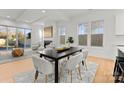 Bright living room with fireplace, comfortable seating, and large windows for ample natural light at 5615 Lantana Ave # A, Charlotte, NC 28205