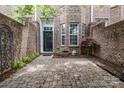 Private brick patio offers a cozy outdoor space for relaxing or entertaining in this brick townhome at 6011 Nw Village Nw Dr, Concord, NC 28027