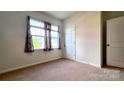 This is a view of the bedroom that has great natural lighting from the large window at 640 Yellow Birch Dr, Locust, NC 28097
