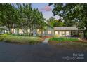 Charming single story home with lush landscaping and a welcoming covered patio at 7204 E 218 Hwy, Marshville, NC 28103