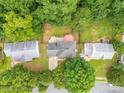 An aerial view of the property showcasing the home's location within a lush, green, and established neighborhood at 8120 Vermilion Dr, Charlotte, NC 28215
