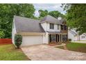 This two story home boasts a two car garage and an easily maintained front lawn at 8120 Vermilion Dr, Charlotte, NC 28215
