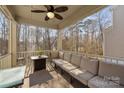 Relaxing screened porch with comfortable seating, ideal for enjoying the natural views at 840 Pecan Tree Ln, Fort Mill, SC 29715