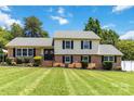Beautifully landscaped home with a lush green lawn and manicured shrubs adding to its curb appeal at 1104 Colony Ct, Gastonia, NC 28056