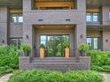 Inviting front entrance with double doors, planters, and brick steps at 112 Manning Dr, Charlotte, NC 28209