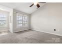 Cozy room with carpet, large windows, and vaulted ceiling, providing plenty of natural light at 1305 Dan Dr, Rock Hill, SC 29732