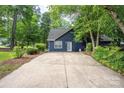 Home showcasing a long driveway, mature landscaping, and a well-maintained exterior at 172 Valleybrook Dr # 8, Denver, NC 28037