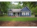 Cozy home with a manicured lawn, lush trees, and a well-kept facade at 172 Valleybrook Dr # 8, Denver, NC 28037