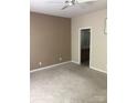 Neutral bedroom featuring carpet floors, ceiling fan, and attached bathroom at 19157 Mallard Dr, Fort Mill, SC 29707