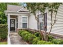 Charming single-story home with a well-manicured front garden, walkway, and inviting entrance at 19157 Mallard Dr, Fort Mill, SC 29707